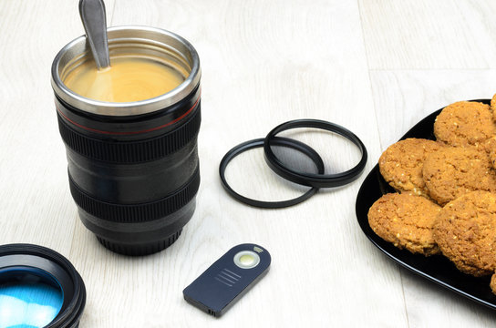 cup that looks like a camera lens - Powered by Adobe
