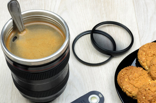 cup that looks like a camera lens - Powered by Adobe