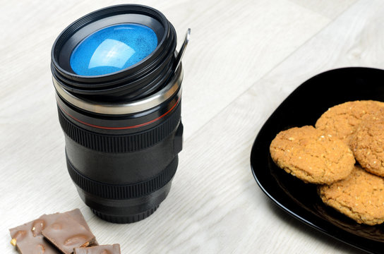 cup that looks like a camera lens - Powered by Adobe