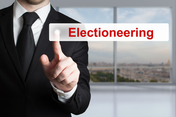 businessman pushing flat touchscreen button electioneering
