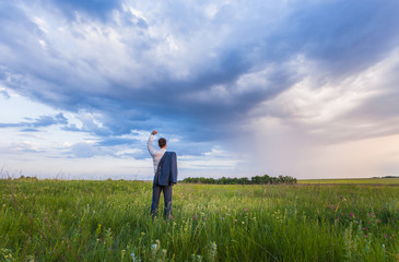 businessman is working in the nature. 