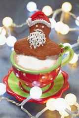 Gingerbread Santa in a hot cup of cappuccino