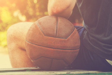 Basketball player on a outdoor court.