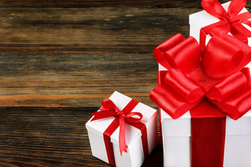 Close-up of gift boxes with red bows