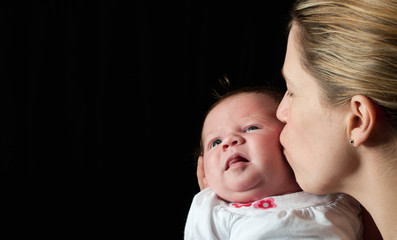 Mother holding her new born baby