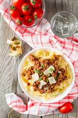 Spaghetti bolognese with salad and tomatoes