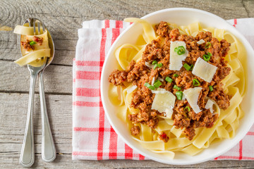 Spaghetti bolognese with salad and tomatoes