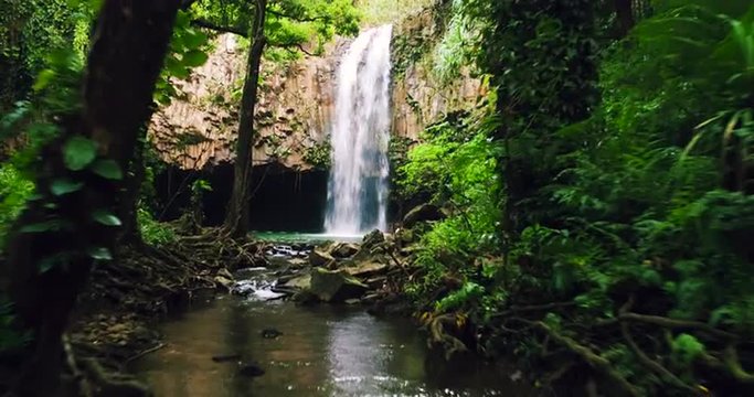 Aerial View of Waterfall. Flying Through Jungle Towards Powerfull Waterfall in Jungle Paradise