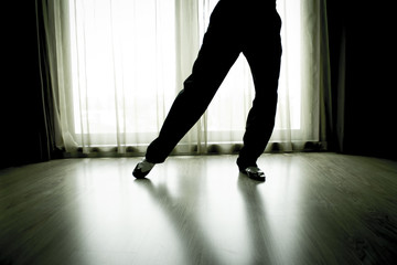 Woman legs in dancing pose 