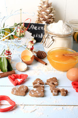 cooking ginger cookies for Christmas homemade cakes on a light wooden background selective soft focus rustic style