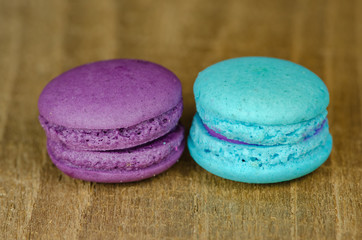 different kinds of macaroon placed on a wooden table