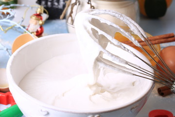 Fototapeta na wymiar whipped egg whites and sugar for baking cream topping