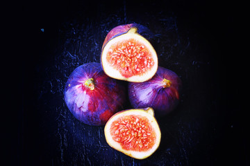 figs on a dark wooden background old retro vintage style selective soft focus