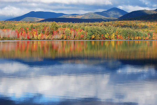 Mirror Image/Chocorua Lake and autumn foliage in the white mountains of New Hampshire, USA.