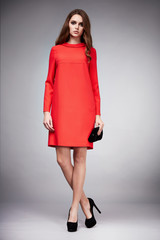 Beautiful young sexy woman with long hair brunette perfect sport thin figure tanned body make-up wearing a dress suit skirt collection catalog shirt style fashion accessories store sale businesswoman