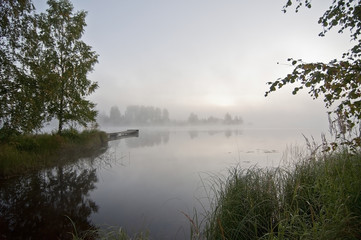 Naklejka na ściany i meble Finland, fog on the water.