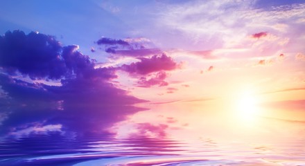 sky at sunset reflected in water