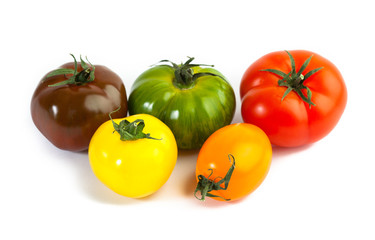 Different colors tomatos, Solanum lycopersicum, on white backgroung
