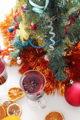 mulled wine with decorated christmas tree