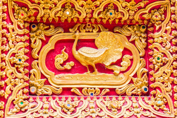 Peacock Wall sculpture in Thai temple