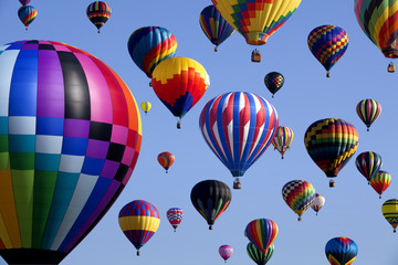 The mass ascension launch of over 100 colorful hot air balloons at the New Jersey Ballooning Festival in White-house Station, New Jersey as a early morning race.