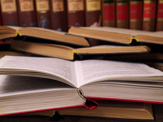 a heap of opened books, shallow depth of field