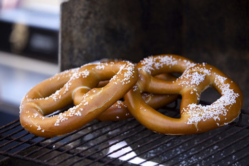 Hot pretzles warming on a BBQ Grill

(note- selective focus)
