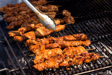 BBQ - Chicken on a stick on a hot grill

(note- selective focus)