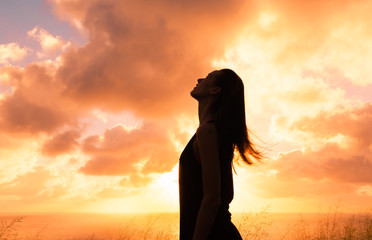 Woman feeling free in a beautiful natural setting.