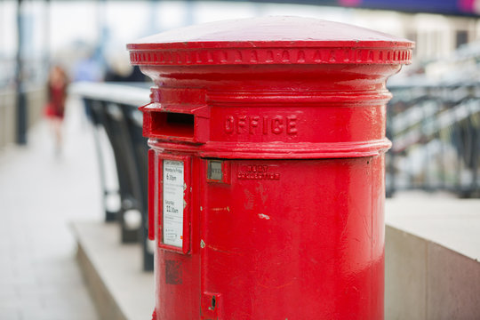 LONDON, UK - SEPTEMBER 14, 2015:  Royal mail red post box in Canary Wharf