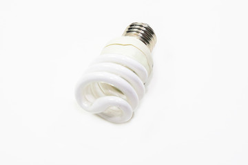 Energy saving fluorescent light bulb on white bakground