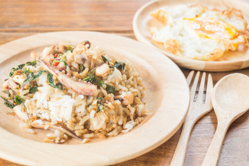Rice topped with stir-fried squid basil and fried egg (Thai food