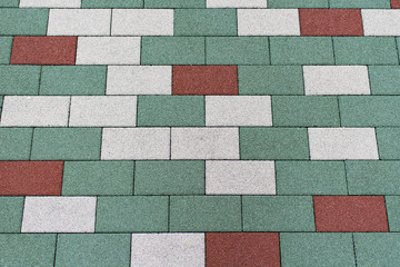 Pavement outdoors floor plates in shades of green , white and red