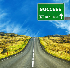 SUCCESS road sign against clear blue sky