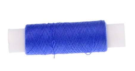 spool of blue thread isolated on white