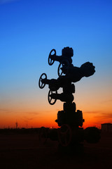 In the evening of oilfield pipeline silhouette