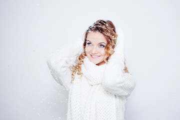 Woman  in  warm knitted scarf and gloves, portrait on  white background, place for your text