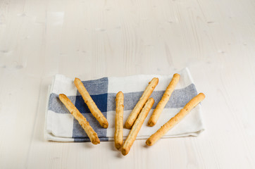 rustic breadsticks  on wood table, close up, background.