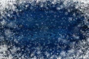 Dark wooden background with snowflakes
