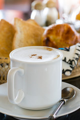 Hot Coffee with Bread in background