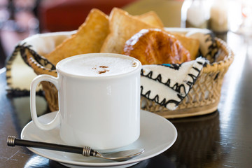 Hot Coffee with Bread in background