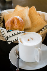 Hot Coffee with Bread in background