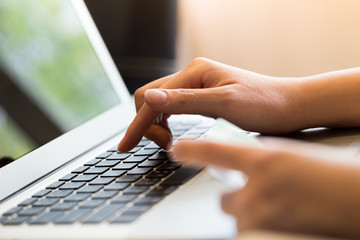 woman holding credit card on laptop for online shopping concept