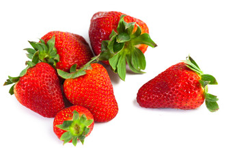 big red juicy rich strawberries with pedicle on white backgrond

