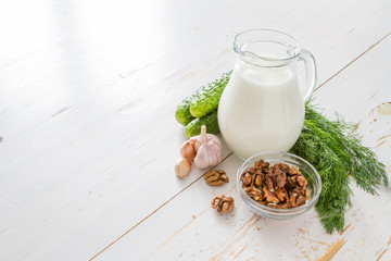 Tarator ingredients on white wood background