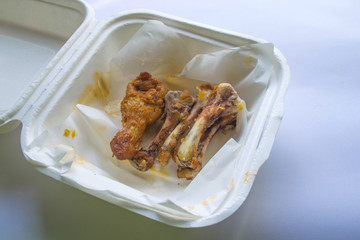 Chicken bones in carton