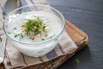 Tarator ingredients on dark stone background