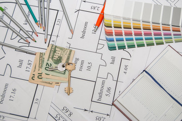 Projects of houses with color palette, pencils, dollar