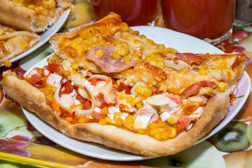 pizza with tomatoes, chicken, corn, crab sticks and cheese