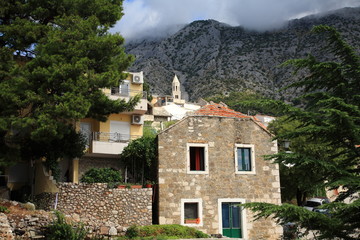 House in a mountain in the background